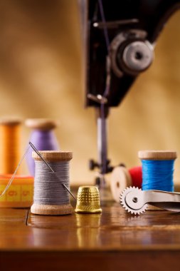 Small sewing wooden bobbin with other items clipart