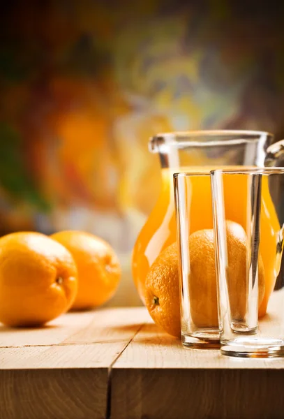 Emrty glassware and oranges — Stock Photo, Image