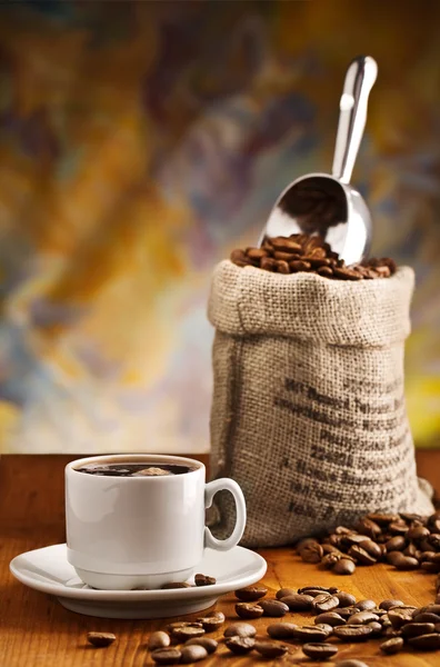 Xícara com café e saco — Fotografia de Stock