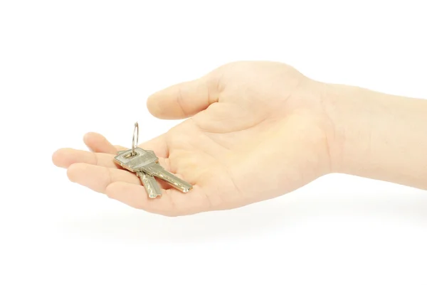 Hand innehåller en nyckel — Stockfoto
