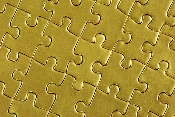 Золотые головоломки — стоковое фото