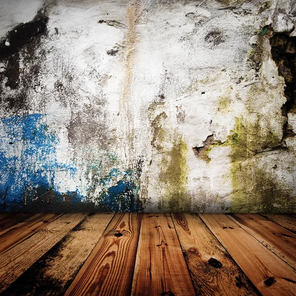 Vecchio muro grunge e pavimento in legno in una stanza — Foto Stock
