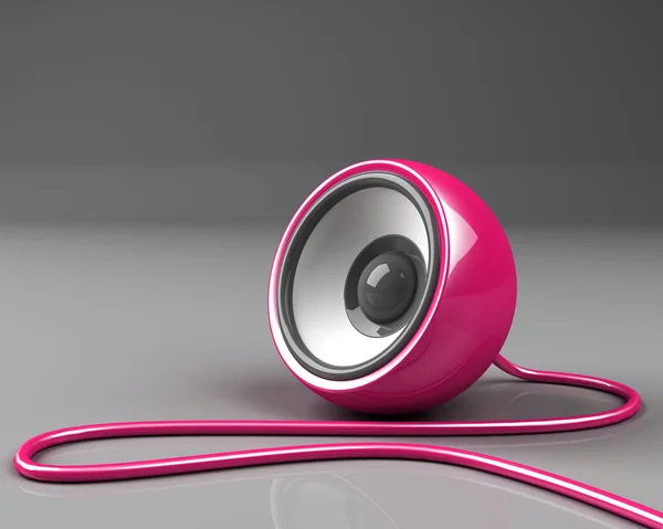 Pink speaker with cable over grey background — Stock Photo, Image