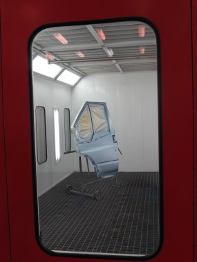 Car door stands in a spray booth clipart