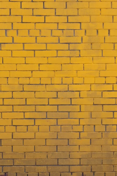 Background with old yellow painted brick wall — Stock Photo, Image