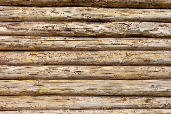 Tronchi di legno parete di sfondo casa rurale — Foto Stock