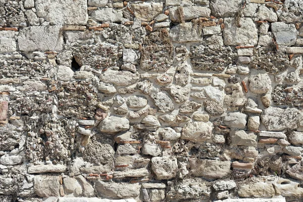 Фон з високо деталізованої фрагментованої кам'яної стіни — стокове фото