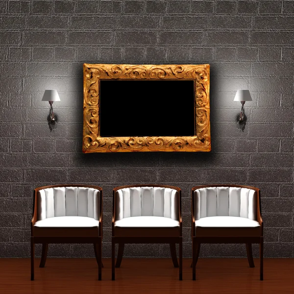 Three chair with empty frame and sconces in dark interior — Stock Photo, Image