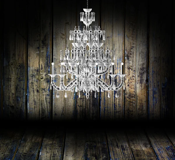 Crystal chandelier hanging in a dark room — Stock Photo, Image