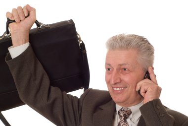 Closeup portrait of an older man talking on a mobile phone again clipart
