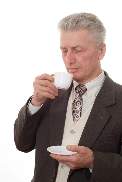 白い backgro のカップから飲むビジネスマンの肖像画 — ストック写真