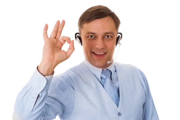 Jovem empresário com fone de ouvido falando — Fotografia de Stock