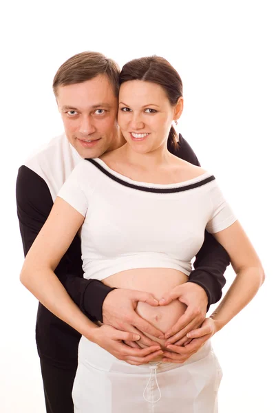 Mujer embarazada de pie junto a su marido —  Fotos de Stock
