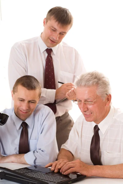 Businessmen working at a table — Stock Photo, Image