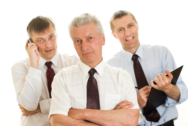 Tre affärsmän på en vit — Stockfoto