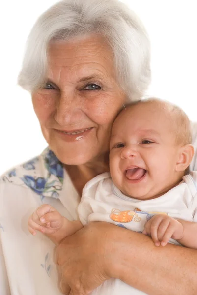 Mulher idosa segurando um recém-nascido — Fotografia de Stock