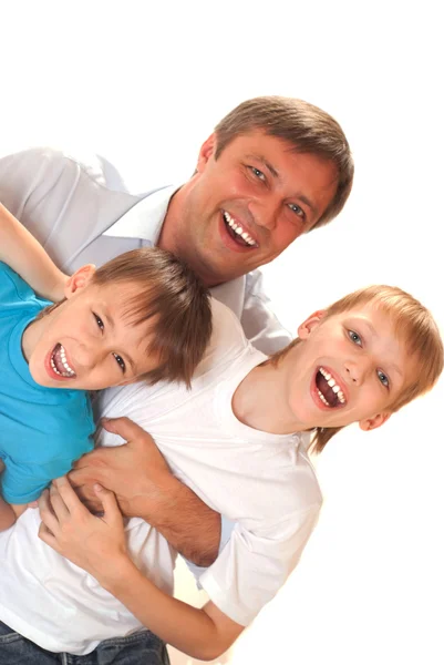 Padre con sus hijos en un blanco — Foto de Stock
