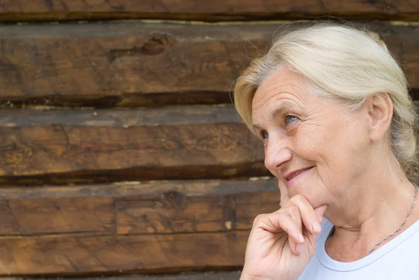 Beautiful older woman stands — Stock Photo, Image
