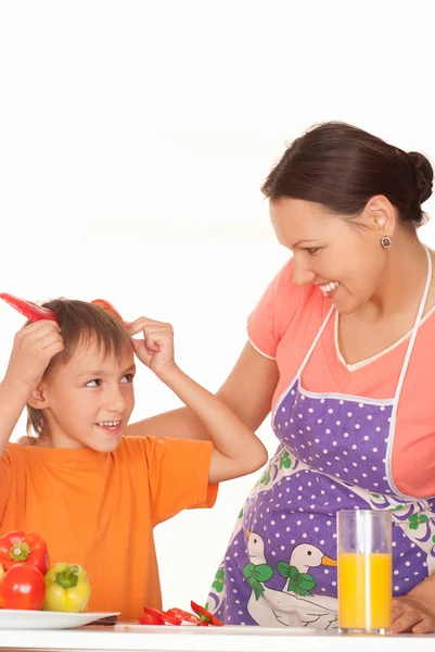 Beautiful mother and son prepares — Stock Photo, Image