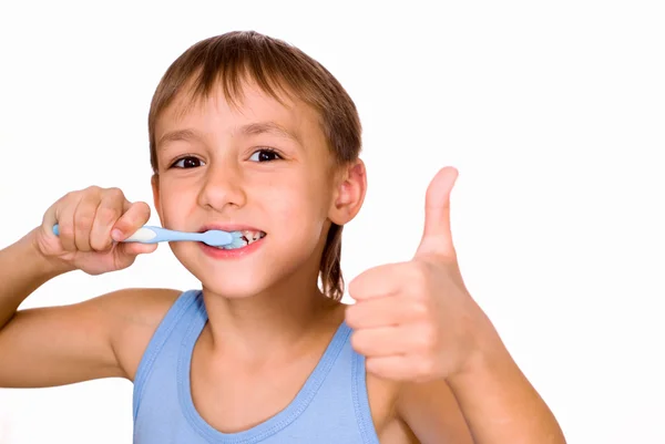 Knappe jongen zijn tanden poetsen — Stockfoto