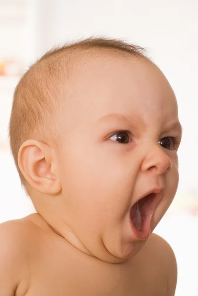 Bebê divertido em um branco — Fotografia de Stock