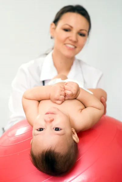 Stock image Doctor with newborn