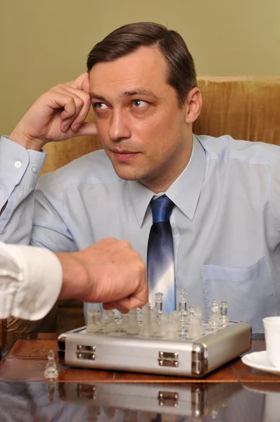 Handsome businessman playing chess — Stock Photo, Image