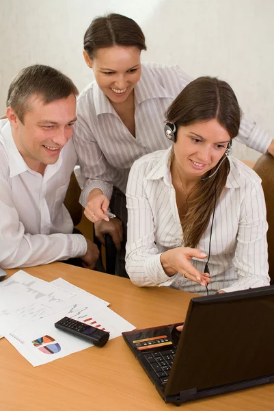 Office team of young with a laptop — Stock Photo, Image