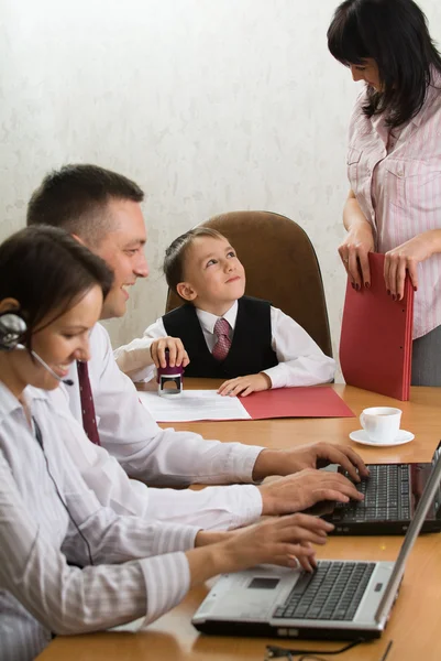Young boss with a seal in his hand — Stock Photo, Image