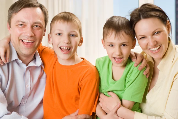 Happy parents with children together Stock Picture
