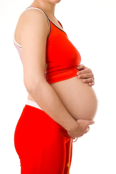 Piękna kobieta w ciąży w kolorze czerwonym — Zdjęcie stockowe