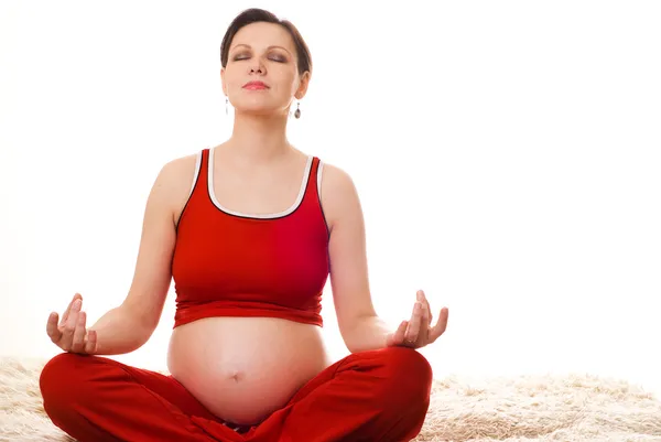 Mujer embarazada meditando —  Fotos de Stock