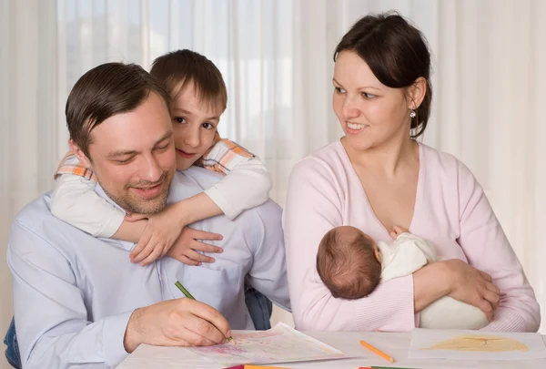 Young couple with two children — Stock Photo, Image