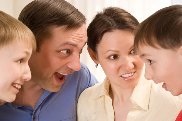 Family standing and surprise talks — Stock Photo, Image