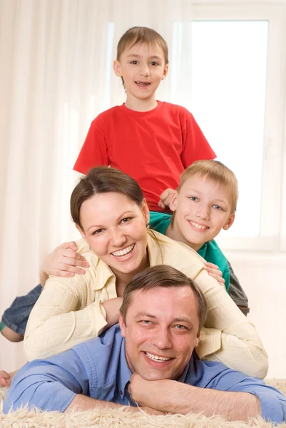 Happy family four Stock Picture