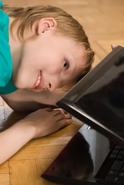 Boy peering into a laptop — Stock Photo, Image