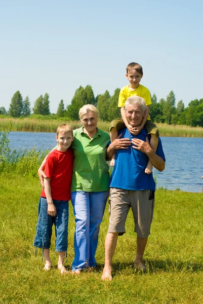 Couple with their grandchildren — Stock Photo, Image