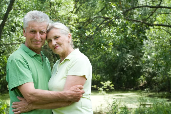 Happy elderly couple in park — Stock Photo, Image