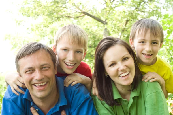 Happy parents are with children — Stock Photo, Image