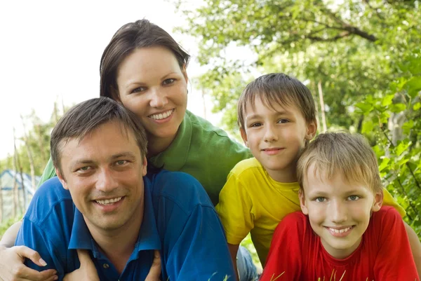 Boys with family in the park — Stock Photo, Image