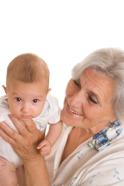 Elderly woman holding a newborn — Stock Photo, Image