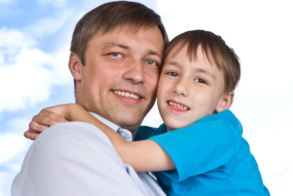 Pai e filho em um branco — Fotografia de Stock