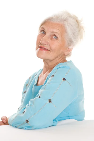 Όμορφη ηλικιωμένη γυναίκα σε ένα λευκό — Φωτογραφία Αρχείου