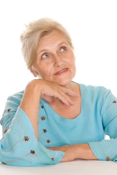 Oudere vrouw op een wit — Stockfoto