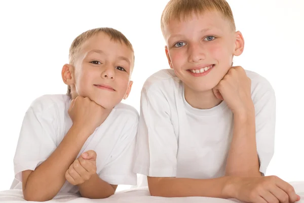 Two brothers on a white — Stock Photo, Image