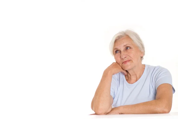 Donna anziana su un bianco — Foto Stock