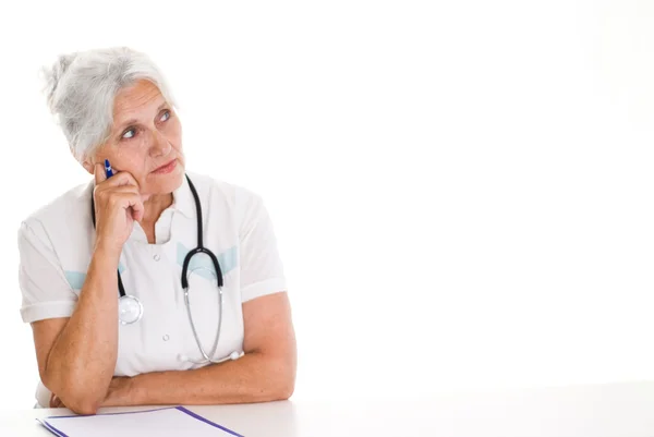 Elderly thoughtful doctor on the wite — Stock Photo, Image