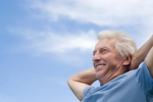 Beautiful older man stands — Stock Photo, Image