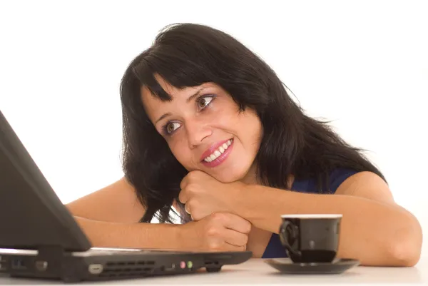 Beautiful young woman behind laptop — Stock Photo, Image