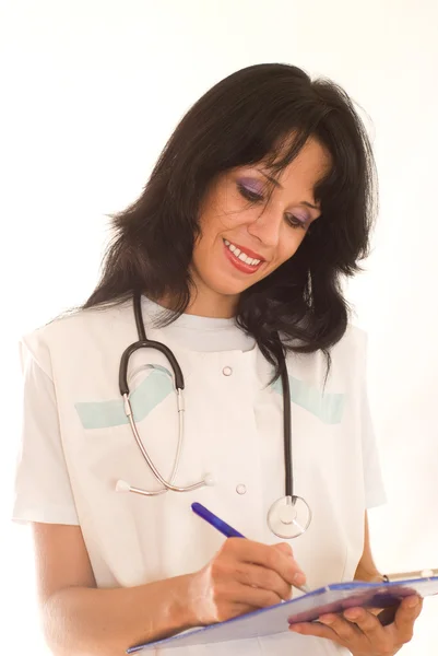 Žena doktor na bílé — Stock fotografie